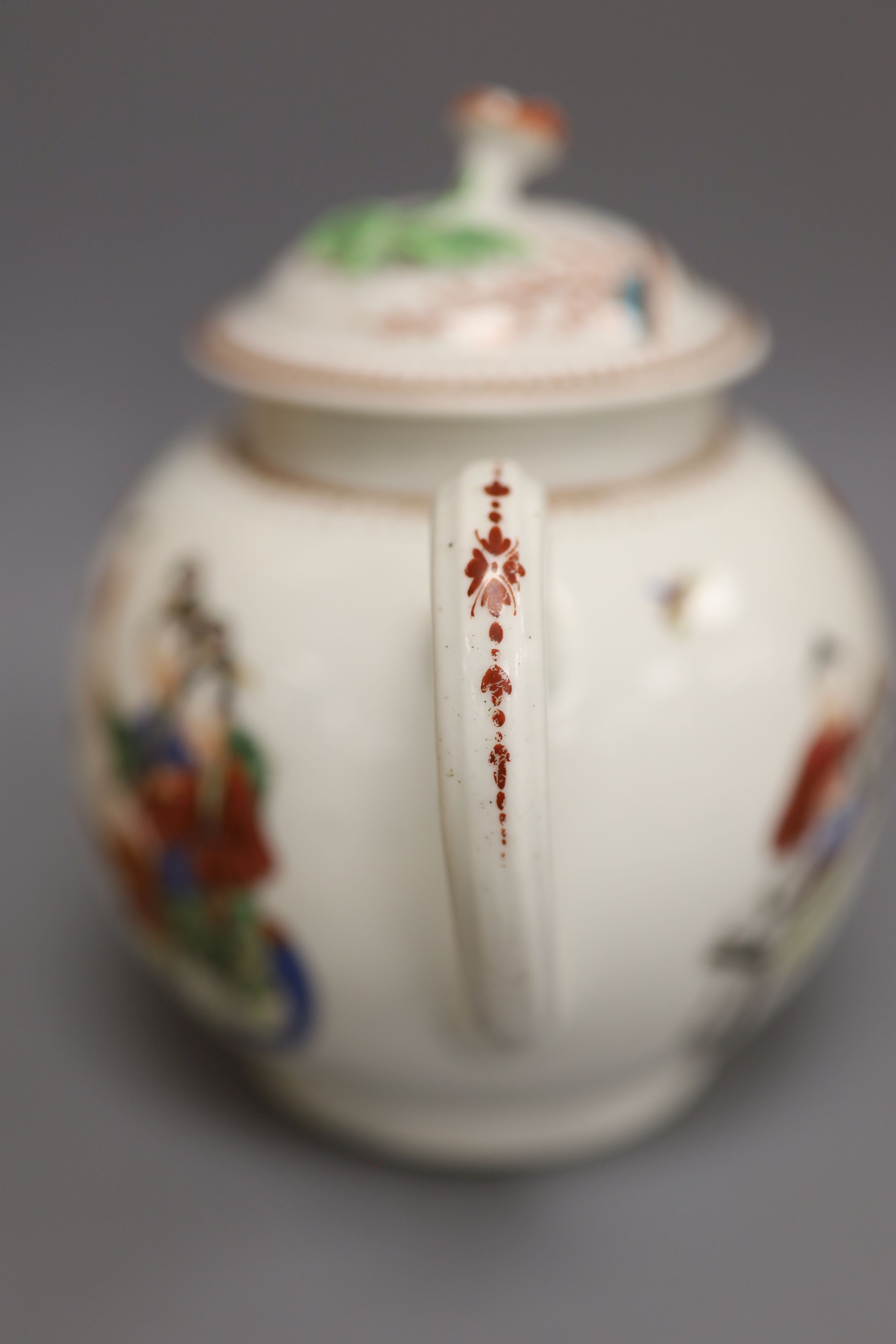 A Worcester teapot and cover painted with Oriental figures in various pursuits, c.1770, height 13cm